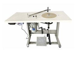 Máquina enrolladora de tejidos estrechos